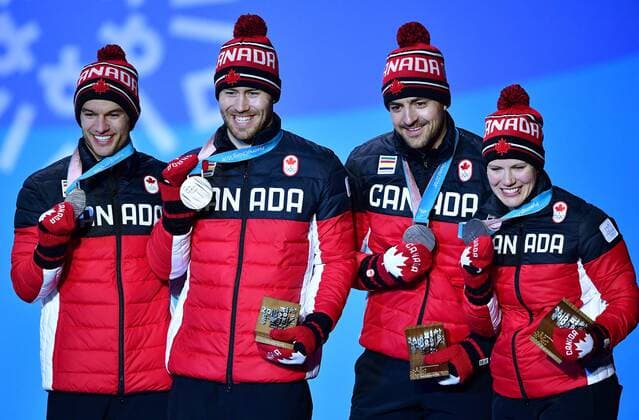 Silver medalist Canada s Alex Gough, Sam Edney, Tristan Walker and Justin Snith, pose during the medal ceremony for Luge Team Relay at the Pyeongchang 2018 Winter Olympics in Pyeongchang, South Korea, on February 16, 2018.  OLY20180216359 KEVINxDIETSCH