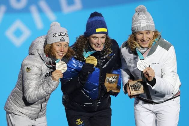 OLYMPICS - 2018 Winter Olympics PYEONGCHANG,SOUTH KOREA,16.FEB.18 - OLYMPICS,BIATHLON - Olympic Winter games Winterspiele Spiele Summer games PyeongChang 2018, Medals Plaza, 15km biathlon, ladies, award ceremony. Image shows Laura Dahlmeier (GER), Hanna Oeberg (SWE) and Anastasiya Kuzmina (SVK). GEPAxpictures xMathiasxMandl