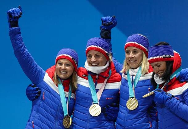 PYEONGCHANG, SOUTH KOREA - FEBRUARY 18, 2018: Gold medalists Ingvild Flugstad Oestberg, Astrid Uhrenholdt Jacobsen, Ragnhild Haga, and Marit Bjoergen (L-R) of Norway pose at a victory ceremony for the ladies cross-country skiing 4x5km relay race at the 2018 Winter Olympic Games Olympische Spiele Olympia OS at the Alpensia Cross-Country Skiing Centre. Valery Sharifulin TASS  TS0747C3