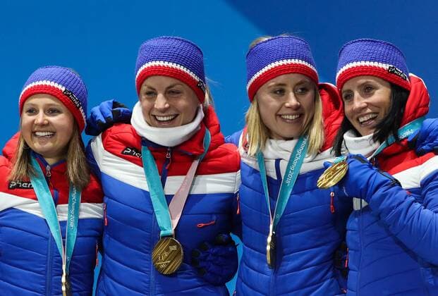 PYEONGCHANG, SOUTH KOREA - FEBRUARY 18, 2018: Gold medalists Ingvild Flugstad Oestberg, Astrid Uhrenholdt Jacobsen, Ragnhild Haga, and Marit Bjoergen (L-R) of Norway pose at a victory ceremony for the ladies cross-country skiing 4x5km relay race at the 2018 Winter Olympic Games Olympische Spiele Olympia OS at the Alpensia Cross-Country Skiing Centre. Valery Sharifulin TASS  TS0747C4