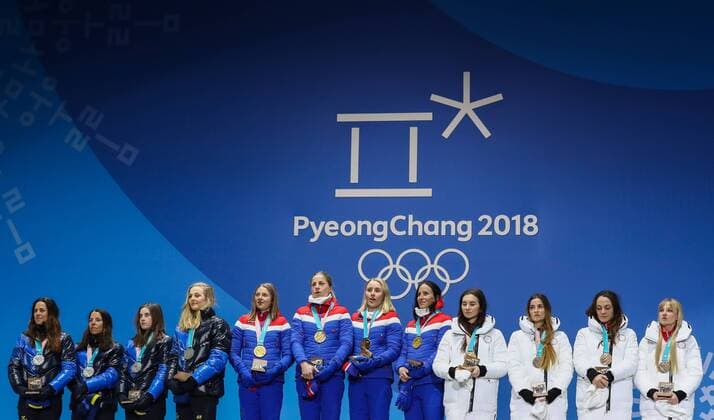 PYEONGCHANG, SOUTH KOREA - FEBRUARY 18, 2018: Silver medalists Anna Haag, Charlotte Kalla, Ebba Andersson, Stina Nilsson of Sweden, gold medalists Ingvild Flugstad Oestberg, Astrid Uhrenholdt Jacobsen, Ragnhild Haga, Marit Bjoergen of Norway, and bronze medalists, Olympic Athletes from Russia Natalia Nepryaeva, Yulia Belorukova, Anastasia Sedova, and Anna Nechaevskaya (L-R) pose at a victory ceremony for the ladies cross-country skiing 4x5km relay race at the 2018 Winter Olympic Games Olympische Spiele Olympia OS at the Alpensia Cross-Country Skiing Centre. Valery Sharifulin TASS TS0747C6