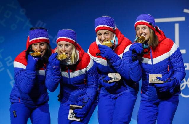 PYEONGCHANG, SOUTH KOREA - FEBRUARY 18, 2018: Gold medalists Marit Bjoergen, Ragnhild Haga, Astrid Uhrenholdt Jacobsen, and Ingvild Flugstad Oestberg (L-R) of Norway pose at a victory ceremony for the ladies cross-country skiing 4x5km relay race at the 2018 Winter Olympic Games Olympische Spiele Olympia OS at the Alpensia Cross-Country Skiing Centre. Valery Sharifulin TASS  TS0747C9
