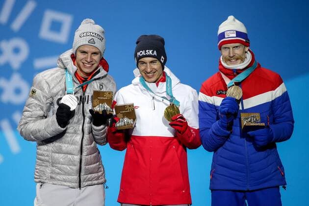 OLYMPICS - 2018 Winter Olympics PYEONGCHANG,SOUTH KOREA,18.FEB.18 - OLYMPICS, NORDIC SKIING, Ski jumping Skispringen Ski nordisch - Olympic Winter games Winterspiele Spiele Summer games PyeongChang 2018, Medals Plaza, large hill, men, award ceremony. Image shows Andrea Wellinger (GER), Kamil Stoch (POL) and Robert Johansson (NOR). Keywords: medals. GEPAxpictures xMaticxKlansek