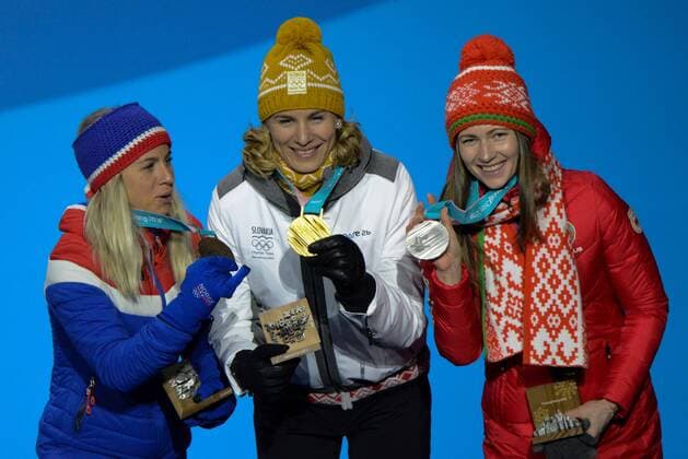 February 18, 2018 - Pyeongchang, South Korea - DARYA DOMRACHEVA of Belarus (left) , ANASTASIYA KUZMINA of Slovakia (center) and TIRIL ECKHOFF of Norway with their medals from the Women s 12.5km Mass Start Biathlon event in the PyeongChang Olympic Games Olympische Spiele Olympia OS Pyeongchang 18: Medal Winners - ZUMAl132 20180218_zap_l132_090 Copyright: xChristopherxLevyx