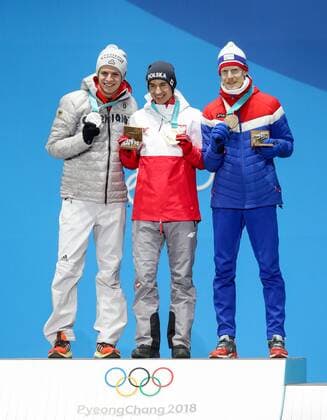 OLYMPICS - 2018 Winter Olympics PYEONGCHANG,SOUTH KOREA,18.FEB.18 - OLYMPICS, NORDIC SKIING, Ski jumping Skispringen Ski nordisch - Olympic Winter games Winterspiele Spiele Summer games PyeongChang 2018, Medals Plaza, large hill, men, award ceremony. Image shows Andrea Wellinger (GER), Kamil Stoch (POL) and Robert Johansson (NOR). Keywords: medals. GEPAxpictures xMaticxKlansek