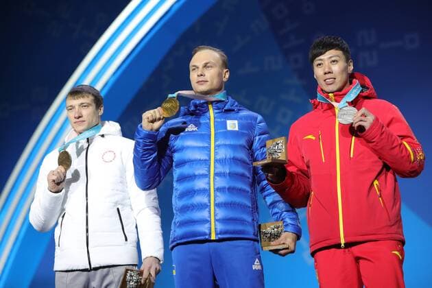 PYEONGCHANG, SOUTH KOREA â€“ FEBRUARY 19, 2018: Bronze medallist Ilya Burov, Olympic Athlete from Russia, gold medallist Oleksandr Abramenko of Ukraine, and silver medallist Jia Zongyang of China, from left, pose at a victory ceremony for the men s freestyle skiing aerials at the 2018 Winter Olympic Games Olympische Spiele Olympia OS Sergei Bobylev TASS  TS074A5F