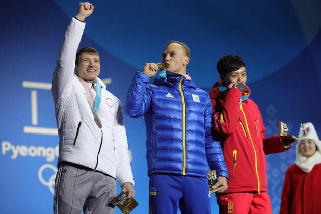 PYEONGCHANG, SOUTH KOREA â€“ FEBRUARY 19, 2018: Bronze medallist Ilya Burov, Olympic Athlete from Russia, gold medallist Oleksandr Abramenko of Ukraine, and silver medallist Jia Zongyang of China, from left, pose at a victory ceremony for the men s freestyle skiing aerials at the 2018 Winter Olympic Games Olympische Spiele Olympia OS Sergei Bobylev TASS  TS074A75