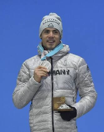 (180219) -- PYEONGCHANG, Feb. 19, 2018 -- Second-placed Germany s Simon Schempp poses for photos during medal ceremony of men s 15km mass start event of biathlon at the 2018 PyeongChang Winter Olympic Games Olympische Spiele Olympia OS at Medal Plaza, PyeongChang, South Korea, Feb. 19, 2018. ) (SP)OLY-SOUTH KOREA-PYEONGCHANG-BIATHLON-MEN S 15KM MASS START-MEDAL CEREMONY LuixSiuxWai 