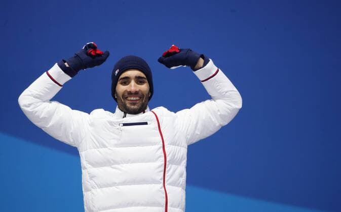 OLYMPICS - 2018 Winter Olympics PYEONGCHANG,SOUTH KOREA,19.FEB.18 - OLYMPICS, BIATHLON - Olympic Winter games Winterspiele Spiele Summer games PyeongChang 2018, Medals Plaza, 15km Mass Start, men, award ceremony. Image shows Martin Fourcade (FRA). GEPAxpictures xAndreasxPranter