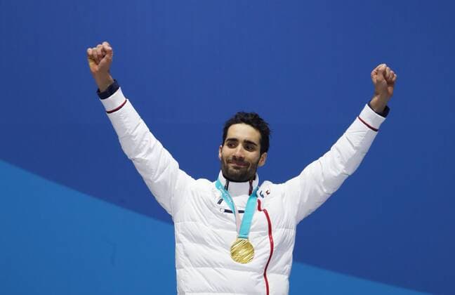 OLYMPICS - 2018 Winter Olympics PYEONGCHANG,SOUTH KOREA,19.FEB.18 - OLYMPICS, BIATHLON - Olympic Winter games Winterspiele Spiele Summer games PyeongChang 2018, Medals Plaza, 15km Mass Start, men, award ceremony. Image shows Martin Fourcade (FRA). Keywords: medal. GEPAxpictures xAndreasxPranter