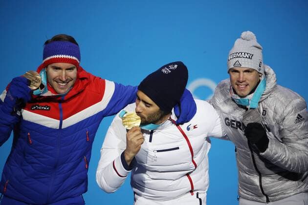 OLYMPICS - 2018 Winter Olympics PYEONGCHANG,SOUTH KOREA,19.FEB.18 - OLYMPICS, BIATHLON - Olympic Winter games Winterspiele Spiele Summer games PyeongChang 2018, Medals Plaza, 15km Mass Start, men, award ceremony. Image shows Emil Hegle Svendsen (NOR), Martin Fourcade (FRA) and Simon Schempp (GER). Keywords: medal. GEPAxpictures xAndreasxPranter