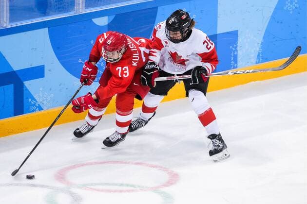 GANGNEUNG, SOUTH KOREA - FEBRUARY 19, 2018: Olympic Athlete from Russia Viktoria Kulishova (L) and Canadaâ€™s Emily Clark in a women s semifinal Ice hockey Eishockey match as part of the 2018 Winter Olympic Games Olympische Spiele Olympia OS at the Gangneung Hockey Centre. Sergei Bobylev TASS  TS074AF2
