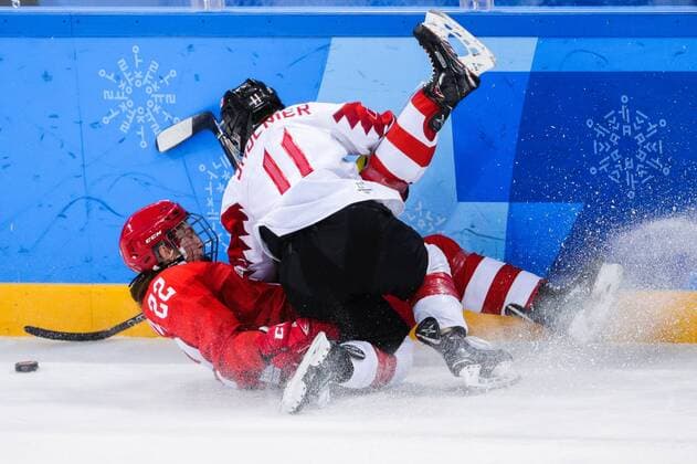 GANGNEUNG, SOUTH KOREA - FEBRUARY 19, 2018: Olympic Athlete from Russia Maria Batalova (L) and Canadaâ€™s Jillian Saulnier in a women s semifinal Ice hockey Eishockey match as part of the 2018 Winter Olympic Games Olympische Spiele Olympia OS at the Gangneung Hockey Centre. Sergei Bobylev TASS  TS074AF4