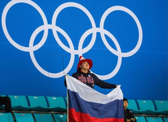 GANGNEUNG, SOUTH KOREA - FEBRUARY 19, 2018: A fan holds the Russian flag at a women s semifinal Ice hockey Eishockey match between Canada and Olympic Athletes from Russia as part of the 2018 Winter Olympic Games Olympische Spiele Olympia OS at the Gangneung Hockey Centre. Sergei Bobylev TASS  TS074AF1