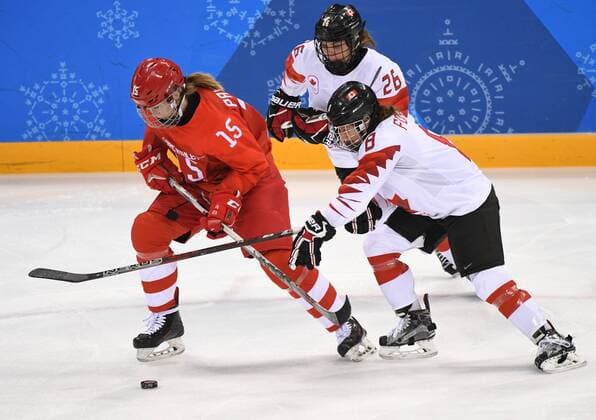 (180219) -- PYEONGCHANG, Feb. 19, 2018 -- Canada s Laura Fortino (R) and Emily Clark (C) vie for the puck with Valeria Pavlova of the Olympic Athlete from Russia during their women s semi-final Ice hockey Eishockey match at the 2018 PyeongChang Winter Olympic Games Olympische Spiele Olympia OS in Gangneung Hockey Centre, South Korea, on Feb. 19, 2018. Canada won 5-0. ) (SP)OLY-SOUTH KOREA-PYEONGCHANG-ICE HOCKEY-WOMEN-SEMIFINAL WangxSong 