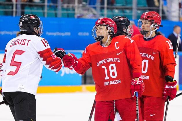 GANGNEUNG, SOUTH KOREA - FEBRUARY 19, 2018: Canadaâ€™s Melodie Daoust and Olympic Athlete from Russia Olga Sosina (L-R front) after a women s semifinal Ice hockey Eishockey match as part of the 2018 Winter Olympic Games Olympische Spiele Olympia OS at the Gangneung Hockey Centre. Sergei Bobylev TASS  TS074B63