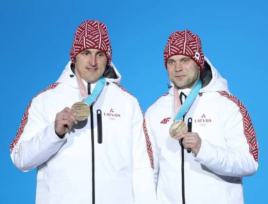 (180220) -- PYEONGCHANG, Feb. 20, 2018 -- Bronze medalists Latvia s Oskars Melbardis and Janis Strenga pose for photos during medal ceremony of 2-man event of bobsleigh at the 2018 PyeongChang Winter Olympic Games Olympische Spiele Olympia OS at Medal Plaza, PyeongChang, South Korea, Feb. 20, 2018. ) (SP)OLY-SOUTH KOREA-PYEONGCHANG-BOBSLEIGH-2-MAN-MEDAL CEREMONY WuxZhuang 