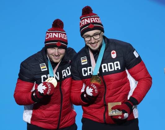 (180220) -- PYEONGCHANG, Feb. 20, 2018 -- Canada s Justin Kripps (L) and Alexander Kopacz pose for photos during medal ceremony of 2-man event of bobsleigh at the 2018 PyeongChang Winter Olympic Games Olympische Spiele Olympia OS at Medal Plaza, PyeongChang, South Korea, Feb. 20, 2018. ) (SP)OLY-SOUTH KOREA-PYEONGCHANG-BOBSLEIGH-2-MAN-MEDAL CEREMONY WuxZhuang 