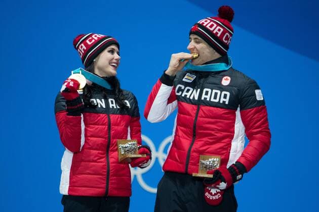 Ice Dance gold medalists Tessa Virtue and Scott Moir of Canada pose for a photo during the medals ceremony at Pyeongchang Medals Plaza in Pyeongchang, South Korea on February 20, 2018.  OLY20180220131 MATTHEWxHEALEY