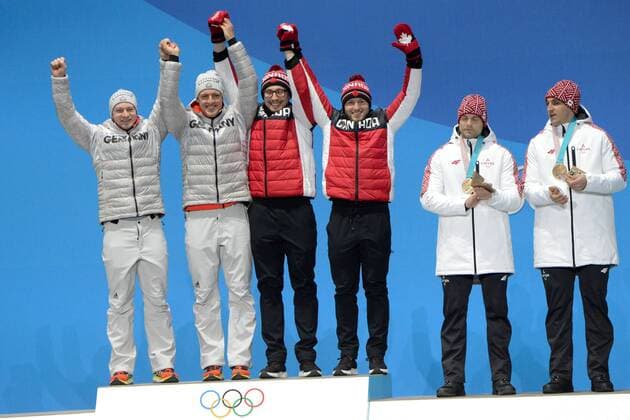 February 20, 2018 - Pyeongchang, South Korea - The German and Canadian 2- man bobsleigh teams celebrate winning the gold medal in the 2-man bobsleigh event in the PyeongChang Olympic Games Olympische Spiele Olympia OS .German team members are Francesco FRANCESCO and THORSTEN MARGIS..Canadians - JUSTIN KRIPPS and ALEXANDER KOPACZ Pyeongchang 18: Medal Winners - ZUMAl132 20180220_zap_l132_042 Copyright: xChristopherxLevyx