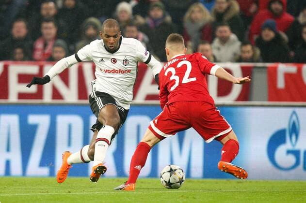 l r in single combat action with Ryan Babel 8 Besiktas Istanbul and Joshua Kimmich 32 Bayern Munich Bayern Munich vs Besiktas Istanbul football knockout Champions League 20 02 2018 Munich Bavaria Germany Copyright: xkolbert-press ChristianxKolbertx