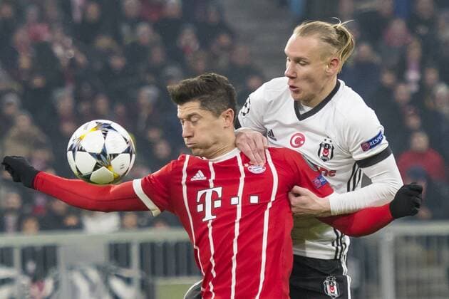 GER UEFA CL Bayern Munich GER vs Besiktas Istanbul TUR 20 02 2018 Allianz Arena Munich GER UEFA CL Bayern Munich GER vs Besiktas Istanbul TUR eighths final pictured Robert Lewandowski FCB 9 in the fight with Domagoj Vida Besiktas 21 nordphotox xStraubmeier nph00004