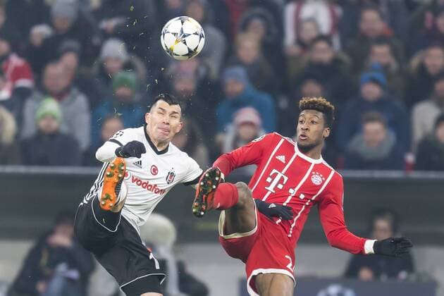 GER UEFA CL Bayern Munich GER vs Besiktas Istanbul TUR 20 02 2018 Allianz Arena Munich GER UEFA CL Bayern Munich GER vs Besiktas Istanbul TUR eighths final pictured Gary MEDEL Besiktas 12 in the fight with Kingsley Coman FCB 29 nordphotox xStraubmeier nph00004