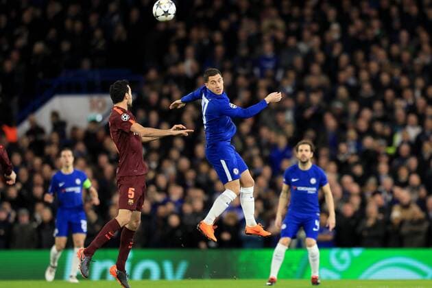 20th February 2018, Stamford Bridge, London, England; UEFA Champions League football, round of 16, 1st leg, Chelsea versus FC Barcelona Barca Eden Hazard of Chelsea flicks the ball over Sergio Busquets of Barcelona  ActionPlus11990621