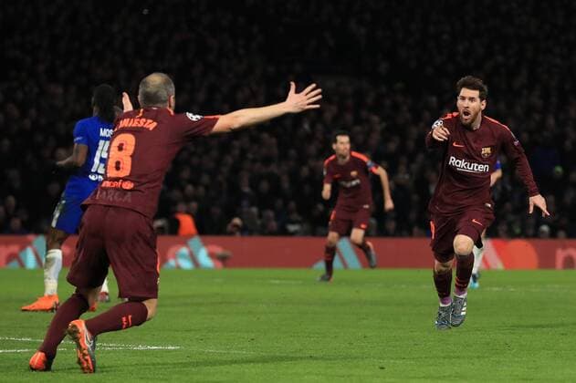 20th February 2018, Stamford Bridge, London, England; UEFA Champions League football, round of 16, 1st leg, Chelsea versus FC Barcelona Barca Lionel Messi of Barcelona celebrates his goal with Andr& xe9;s Iniesta after making it 1-1  ActionPlus11990643