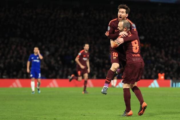 20th February 2018, Stamford Bridge, London, England; UEFA Champions League football, round of 16, 1st leg, Chelsea versus FC Barcelona Barca Lionel Messi of Barcelona celebrates his goal with Andr& xe9;s Iniesta after making it 1-1  ActionPlus11990644