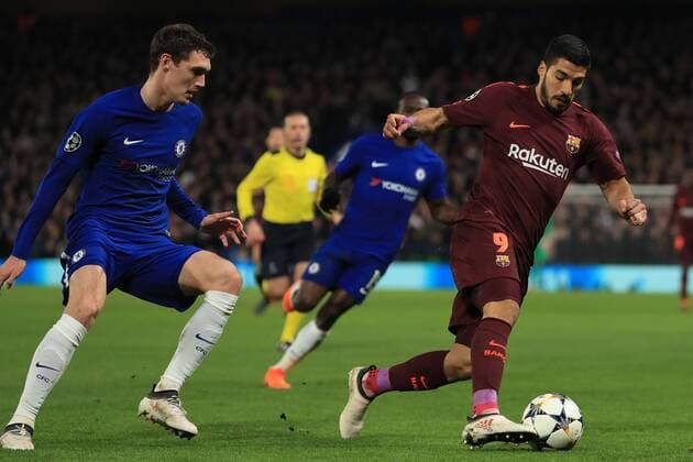 20th February 2018, Stamford Bridge, London, England; UEFA Champions League football, round of 16, 1st leg, Chelsea versus FC Barcelona Barca Luis Su& xe1;rez of Barcelona is under pressure from Andreas Christensen of Chelsea  ActionPlus11990718