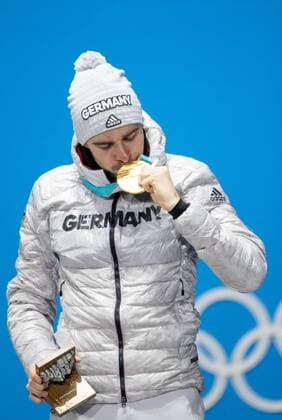 OLYMPICS - 2018 Winter Olympics PYEONGCHANG,SOUTH KOREA,21.FEB.18 - OLYMPICS,NORDIC SKIING, NORDIC COMBINED - Olympic Winter games Winterspiele Spiele Summer games PyeongChang 2018, Medals Plaza, individual large hill, men, award ceremony. Image shows the rejoicing of Johannes Rydzek (GER). Keywords: medal. GEPAxpictures xMaticxKlansek