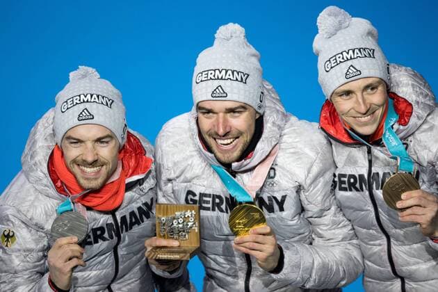OLYMPICS - 2018 Winter Olympics PYEONGCHANG,SOUTH KOREA,21.FEB.18 - OLYMPICS,NORDIC SKIING, NORDIC COMBINED - Olympic Winter games Winterspiele Spiele Summer games PyeongChang 2018, Medals Plaza, individual large hill, men, award ceremony. Image shows the rejoicing of Eric Frenzel (GER), Johannes Rydzek (GER) and Fabian Riessle (GER). Keywords: medals. GEPAxpictures xMaticxKlansek