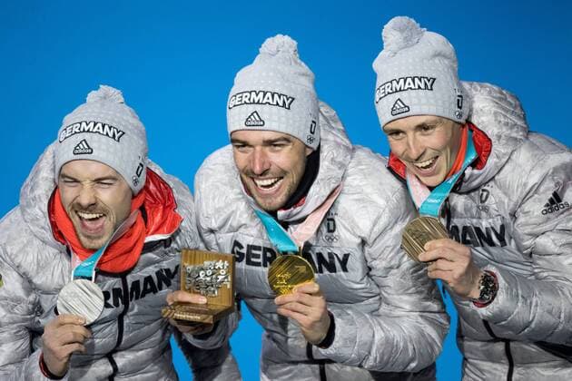OLYMPICS - 2018 Winter Olympics PYEONGCHANG,SOUTH KOREA,21.FEB.18 - OLYMPICS,NORDIC SKIING, NORDIC COMBINED - Olympic Winter games Winterspiele Spiele Summer games PyeongChang 2018, Medals Plaza, individual large hill, men, award ceremony. Image shows the rejoicing of Eric Frenzel (GER), Johannes Rydzek (GER) and Fabian Riessle (GER). Keywords: medals. GEPAxpictures xMaticxKlansek