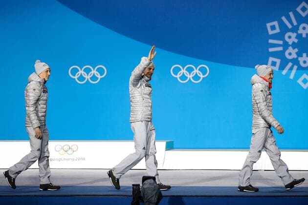 OLYMPICS - 2018 Winter Olympics PYEONGCHANG,SOUTH KOREA,21.FEB.18 - OLYMPICS,NORDIC SKIING, NORDIC COMBINED - Olympic Winter games Winterspiele Spiele Summer games PyeongChang 2018, Medals Plaza, individual large hill, men, award ceremony. Image shows Eric Frenzel (GER), Johannes Rydzek (GER) and Fabian Riessle (GER). GEPAxpictures xMaticxKlansek