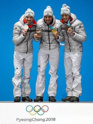 OLYMPICS - 2018 Winter Olympics PYEONGCHANG,SOUTH KOREA,21.FEB.18 - OLYMPICS,NORDIC SKIING, NORDIC COMBINED - Olympic Winter games Winterspiele Spiele Summer games PyeongChang 2018, Medals Plaza, individual large hill, men, award ceremony. Image shows Eric Frenzel (GER), Johannes Rydzek (GER) and Fabian Riessle (GER). Keywords: medals. GEPAxpictures xMaticxKlansek