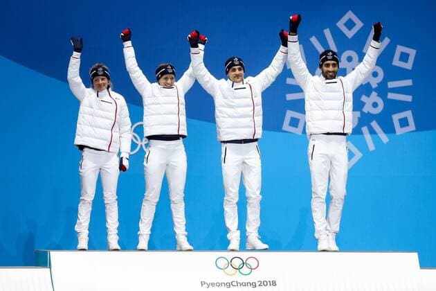 OLYMPICS - 2018 Winter Olympics PYEONGCHANG,SOUTH KOREA,21.FEB.18 - OLYMPICS,BIATHLON - Olympic Winter games Winterspiele Spiele Summer games PyeongChang 2018, Medals Plaza, 2 x 6km and 2 x 7,5km, mixed relay, award ceremony. Image shows the rejoicing of Marie Dorin Habert, Anais Bescond, Simon Desthieux and Martin Fourcade (FRA). GEPAxpictures xMaticxKlansek