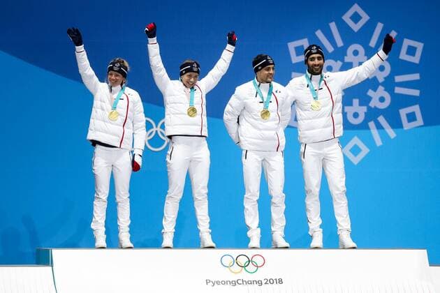 OLYMPICS - 2018 Winter Olympics PYEONGCHANG,SOUTH KOREA,21.FEB.18 - OLYMPICS,BIATHLON - Olympic Winter games Winterspiele Spiele Summer games PyeongChang 2018, Medals Plaza, 2 x 6km and 2 x 7,5km, mixed relay, award ceremony. Image shows the rejoicing of Marie Dorin Habert, Anais Bescond, Simon Desthieux and Martin Fourcade (FRA). Keywords: medals. GEPAxpictures xMaticxKlansek