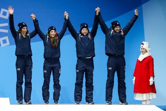 OLYMPICS - 2018 Winter Olympics PYEONGCHANG,SOUTH KOREA,21.FEB.18 - OLYMPICS,BIATHLON - Olympic Winter games Winterspiele Spiele Summer games PyeongChang 2018, Medals Plaza, 2 x 6km and 2 x 7,5km, mixed relay, award ceremony. Image shows the rejoicing of Lisa Vittozzi, Dorothea Wierer, Lukas Hofer and Dominik Windisch (ITA). GEPAxpictures xMaticxKlansek