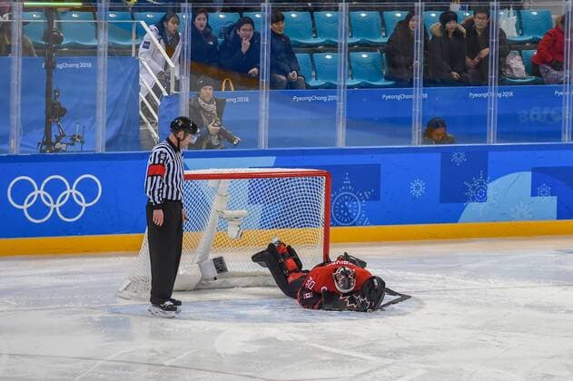 PYEONGCHANG, South Korea - FEBRUARY 21: Canada men s hockey goalie Ben Scrivens (30) is face down on the ice after taking a heavy hit during second period action during the men s hockey semi final game between Canada and Finland during the 2018 Winter Olympic Games Olympische Spiele Olympia OS at the Gangneung Hockey Center on February 21, 2018 in PyeongChang, South Korea. Canada advances to the gold medal game with 1-0 victory. (Photo by Ken Murray Icon Sportswire) OLYMPICS: FEB 21 PyeongChang - Day 14 Icon18022114016 EDITORIAL USE ONLY