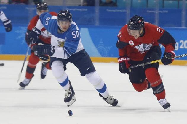 February 21, 2018 - Pyeongchang, KOREA - Finland defenseman Miika Koivisto (50) and Canada forward Mason Raymond (21) in the men s quarterfinal hockey game between Finland and Canada at the Pyeongchang 2018 Olympic Winter games Winterspiele Spiele Summer games at Gangneung Hockey Centre. Canada beat Finland 1-0. Olympics Pyeongchang 2018: Ice hockey Eishockey Men Team Quarterfinal-CAN-FIN - ZUMAm117 20180221_zaf_m117_265 Copyright: xDavidxG.xMcintyrex