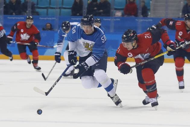 February 21, 2018 - Pyeongchang, KOREA - Finland defenseman Miika Koivisto (50) and Canada forward Mason Raymond (21) in the men s quarterfinal hockey game between Finland and Canada at the Pyeongchang 2018 Olympic Winter games Winterspiele Spiele Summer games at Gangneung Hockey Centre. Canada beat Finland 1-0. Olympics Pyeongchang 2018: Ice hockey Eishockey Men Team Quarterfinal-CAN-FIN - ZUMAm117 20180221_zaf_m117_276 Copyright: xDavidxG.xMcintyrex