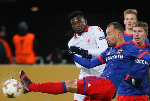 MOSCOW, RUSSIA - FEBRUARY 21, 2018: Crvena Zvezda Belgradeâ€™s El Fardou Ben Nabouhane, CSKA Moscow s Sergei Ignashevich and Kirill Nababkin (L-R front) in their 2017-2018 UEFA Europa League Round of 32 second leg football match at VEB Arena in Moscow. Mikhail Metzel TASS  TS075226