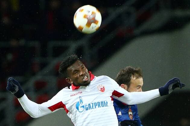 MOSCOW, RUSSIA - FEBRUARY 21, 2018: Crvena Zvezda Belgradeâ€™s El Fardou Ben Nabouhane (front) and CSKA Moscow s Bibras Natkho in their 2017-2018 UEFA Europa League Round of 32 second leg football match at VEB Arena in Moscow. Mikhail Tereshchenko TASS  TS075231