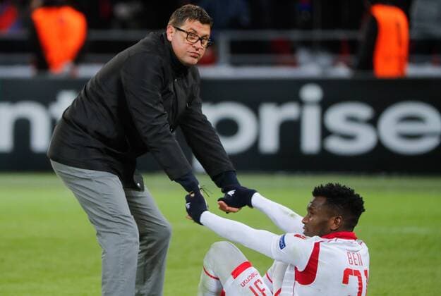 MOSCOW, RUSSIA - FEBRUARY 21, 2018: Crvena Zvezda Belgrade head coach Vladan Milojevic (L) helps his player El Fardou Ben Nabouhane on his feet after their 2017-2018 UEFA Europa League Round of 32 second leg football match against CSKA Moscow at VEB Arena in Moscow; CSKA Moscow won 1-0. Mikhail Metzel TASS  TS075260