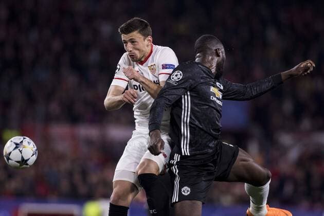 February 21, 2018 - Seville, Spain - CLEMENT LENGLET of Sevilla (L ) vies for the ball with ROMELU LUKAKU of Manchester (R) during the UEFA Champions League Round of 16 (first leg) match between Sevilla FC and Manchester United ManU at Estadio Ramon Sanchez Pizjuan Soccer 2018 - Sevilla FC vs Manchester United - ZUMAa142 20180221_zap_a142_003 Copyright: xDanielxGonzalezxAcunax