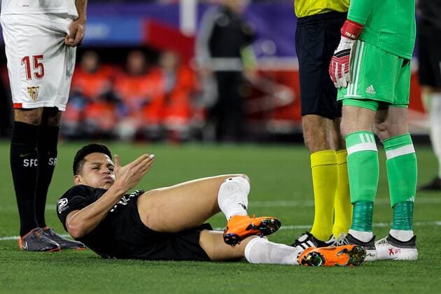 21st February 2018, Ramon Sanchez Pizjuan, Seville, Spain; UEFA Champions League football, round of 16, 1st leg, Sevilla versus Manchester United ManU Alexis Sanchez injured laying on the pitch  ActionPlus11991055