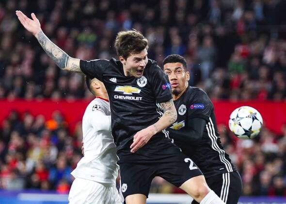 21st February 2018, Ramon Sanchez Pizjuan, Seville, Spain; UEFA Champions League football, round of 16, 1st leg, Sevilla versus Manchester United ManU Lindelof from Manchester United fights for the ball  ActionPlus11991134
