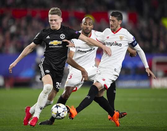 Sevilla; SPAIN-FEBRUARY 21:; (L-R) Scott Mc Tominay of Manchester United ManU Steven N?Zonzi,Sergio Escudero of Sevilla FC during the Champions League match between Sevilla FC v Manchester United at the Sanchez Pizjuan stadium on February 21th; 2018 in Sevilla Spain (PHOTO by Cristobal Duenas  xx xx