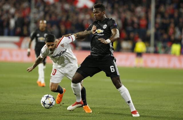 Partido de ida de octavos de la Liga de Campeones entre el Sevilla y el Manchester United ManU en el Pizjuan. En la imagen, Pogba y Banega. First leg of 1 8 Champions League match between Sevilla and Manchester United. In this picture, Pogba and Banega. 